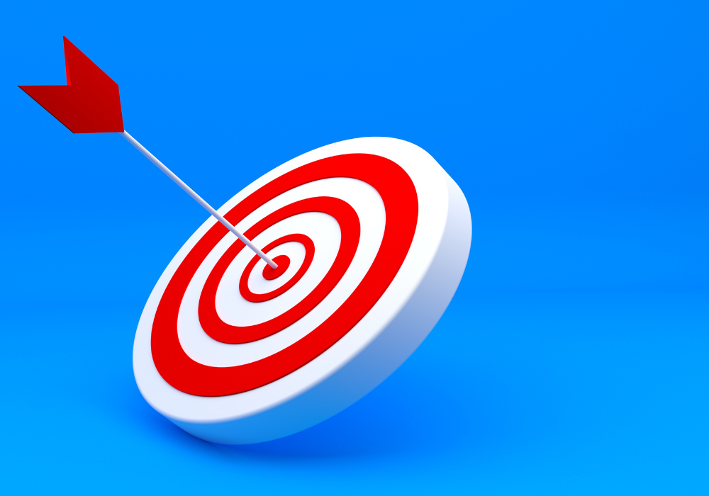 An image of a target board with an arrow hitting the bullseye