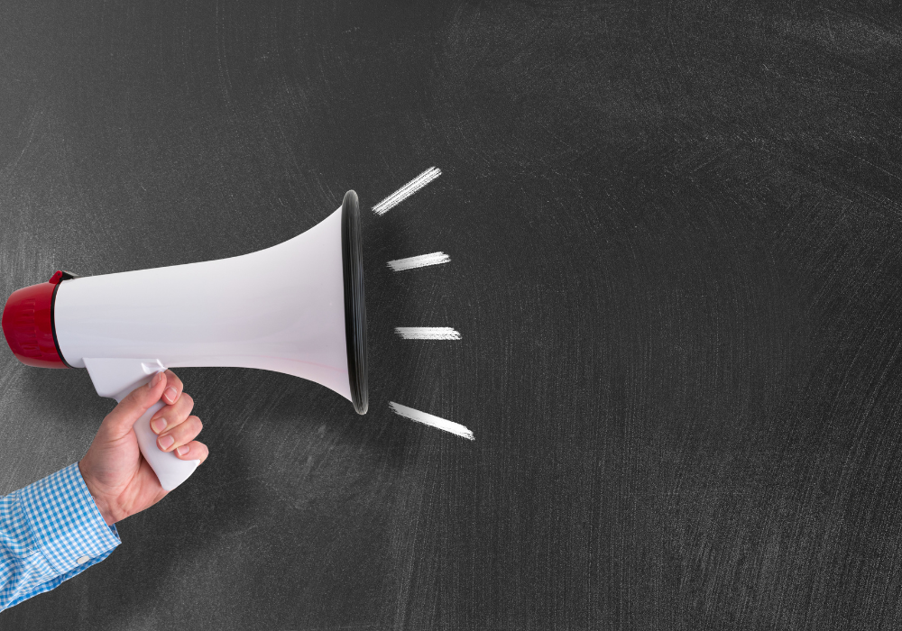 Image of a hand holding a megaphone